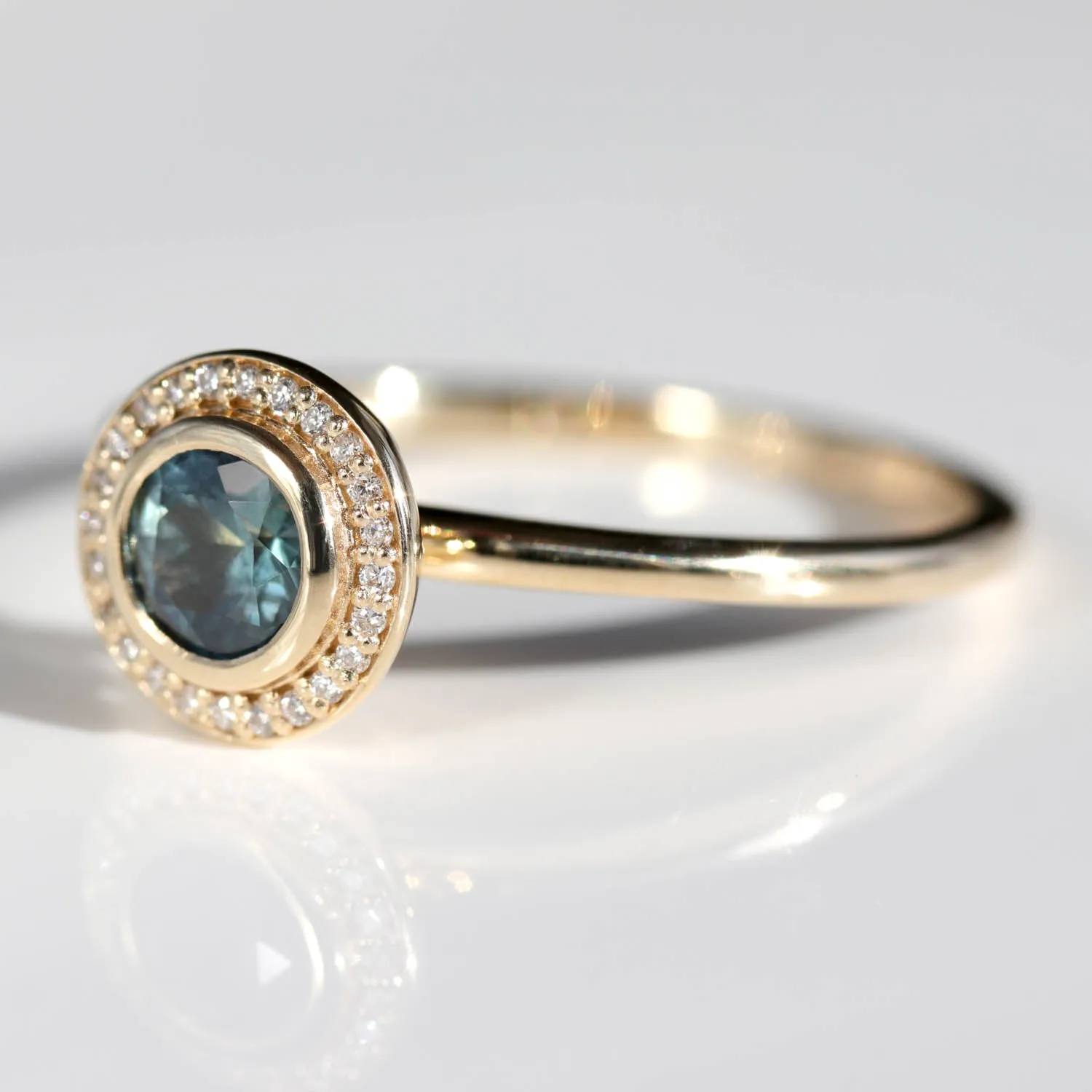 5mm Bezel-set Halo Solitaire Engagement Ring with Teal Malawi Sapphire