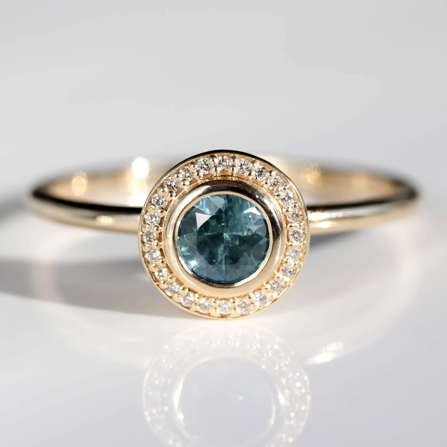 5mm Bezel-set Halo Solitaire Engagement Ring with Teal Malawi Sapphire